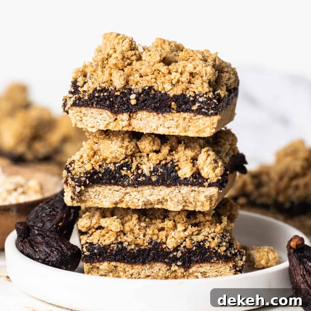 A stack of fig bars on a plate.