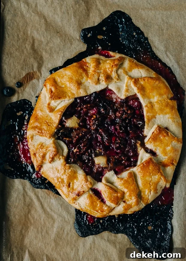 A baked Cranberry Wine Galette on parchment.