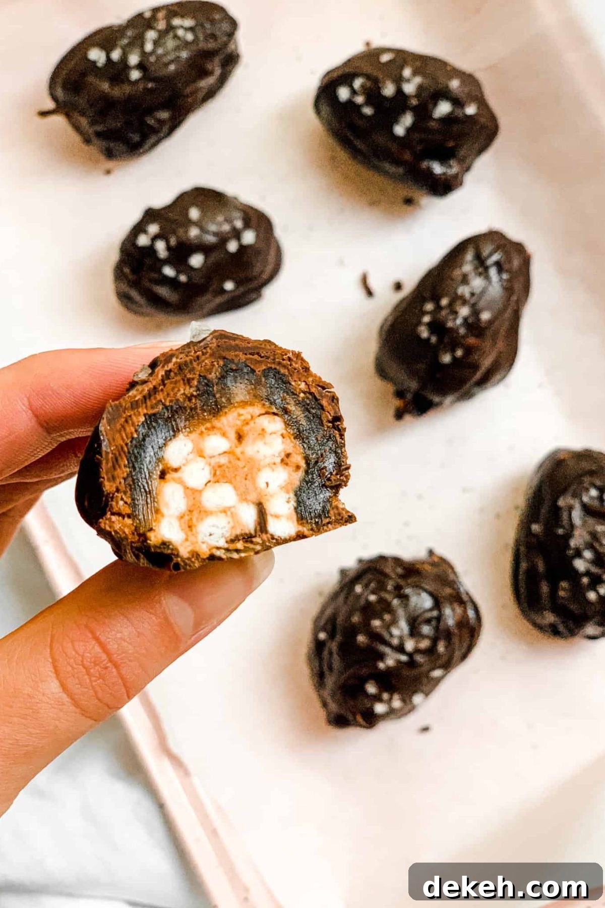 Pink Baking Sheet with Healthy Salted Chocolate Date Candies with Brown Rice Cereal