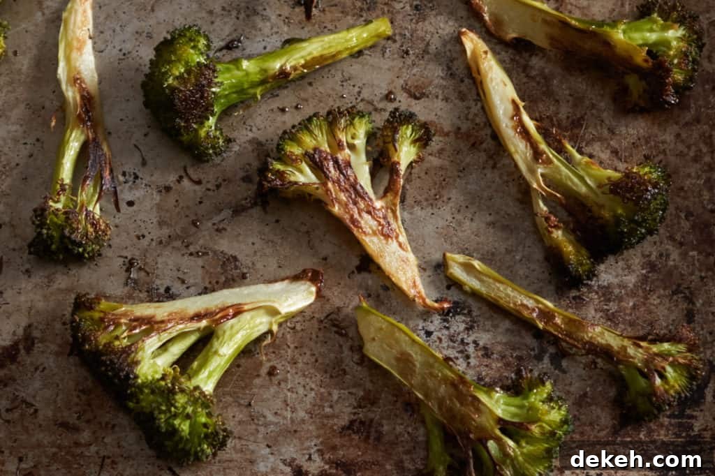 Charred broccoli on a sheet pan.