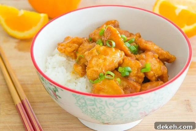 Orange Chicken in a Bowl with Rice and Scallions