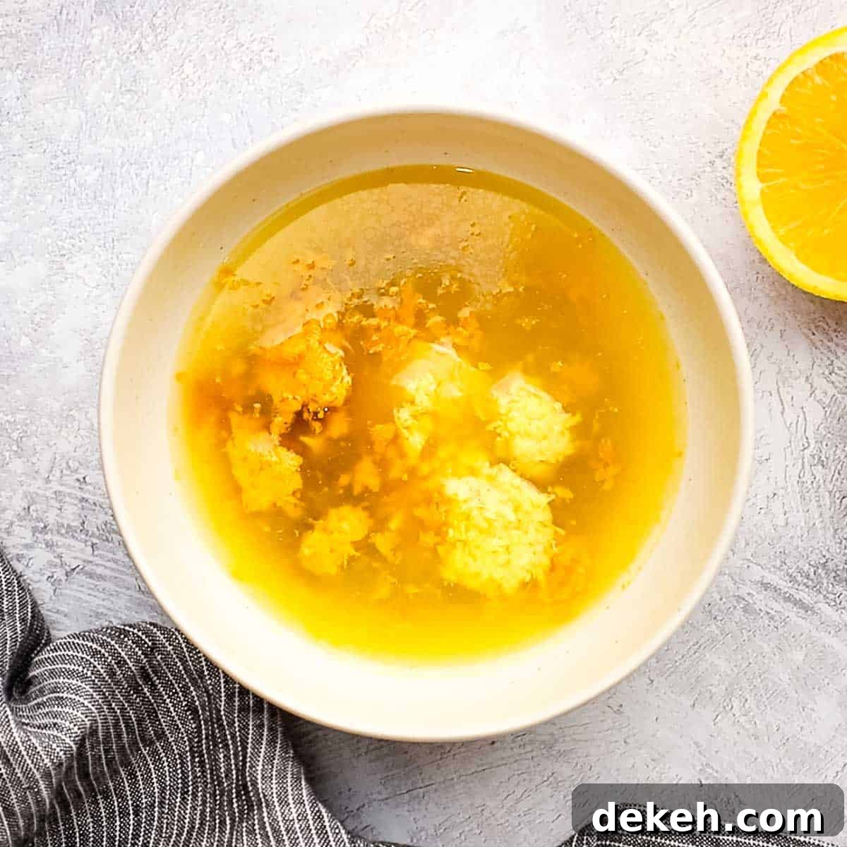 ingredients to make orange ginger dressing in a small bowl