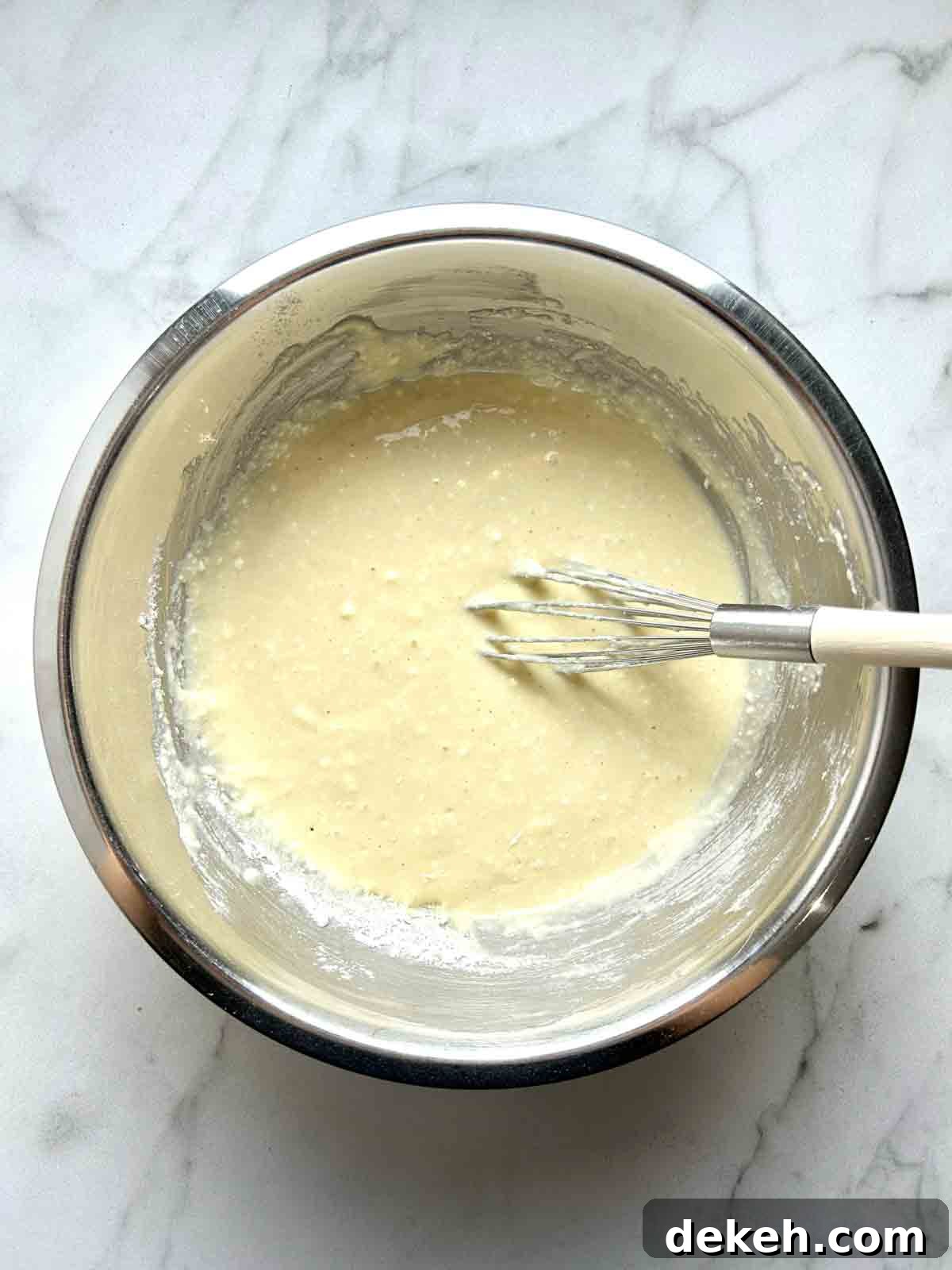 batter being whisked in bowl.