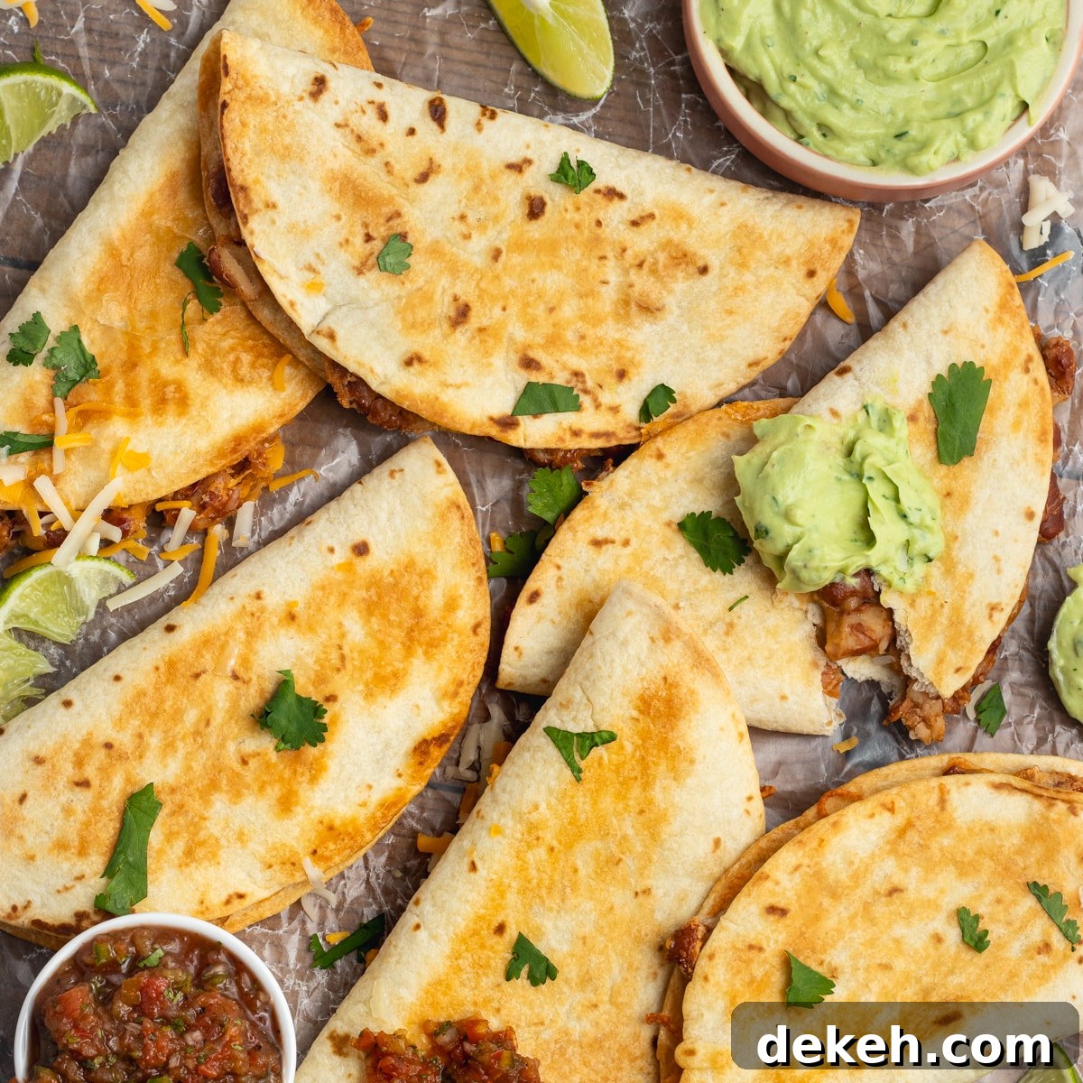 This is a square picture of baked bean and cheese tacos.