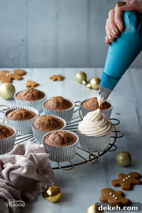 A round cooling rack topped with gingerbread cupcakes