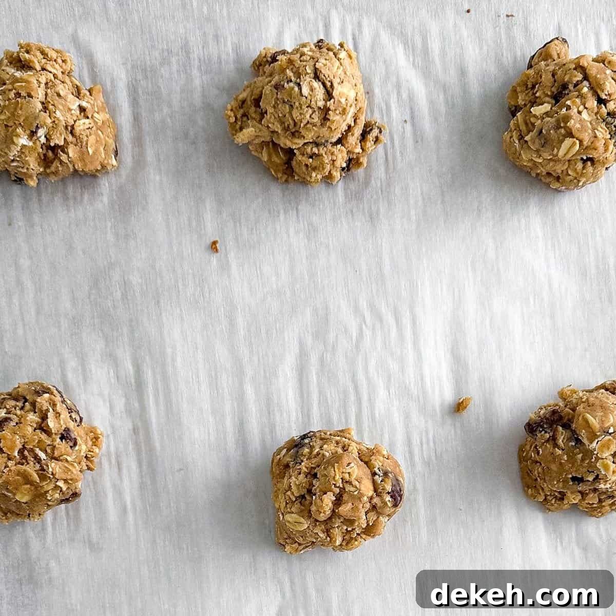 Scoops of dough on a sheet pan.
