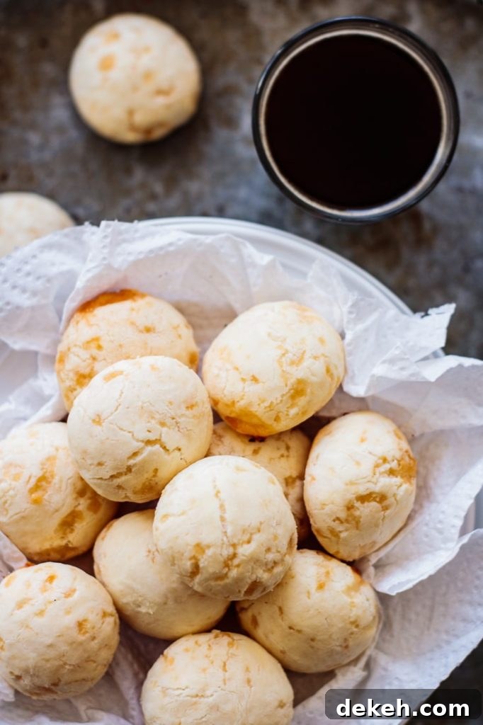 plate full of classic brazilian cheese bread with a black coffee on the side