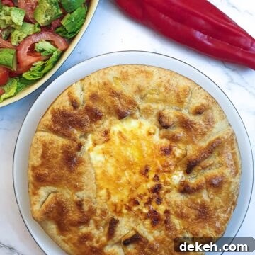 A Tex Mex beef pie showing the crispy pastry around the edge and the golden melted cheese in the middle.