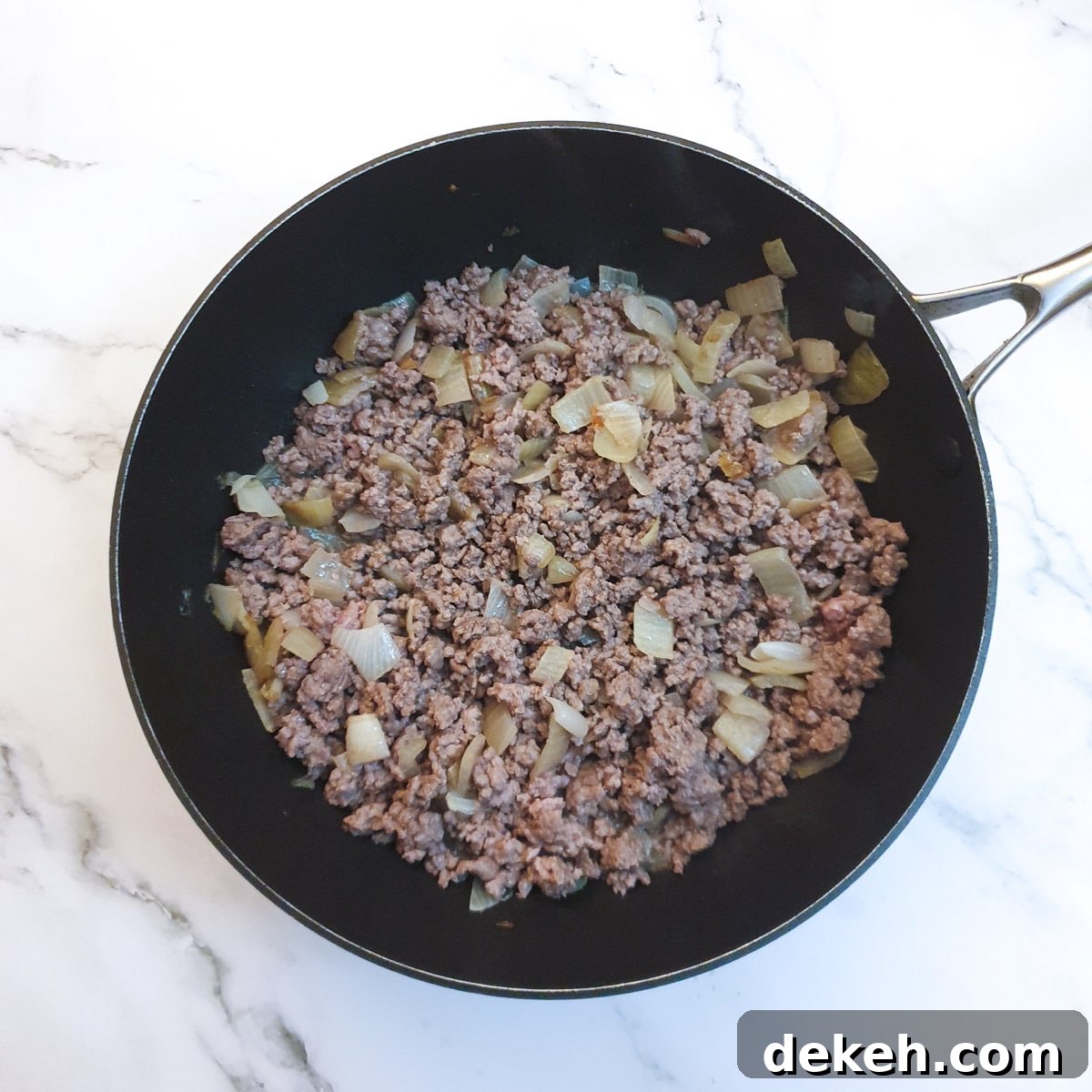 Ground beef browning with the onions.