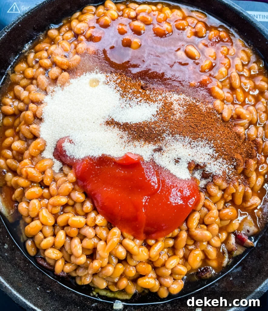 baked beans, ketchup, BBQ sauce, and brown sugar in a cast iron skillet