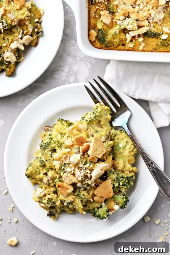 Two plates filled with No Cheese Broccoli Casserole.