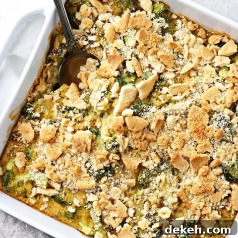 A white baking dish filled with Dairy Free Broccoli Casserole.