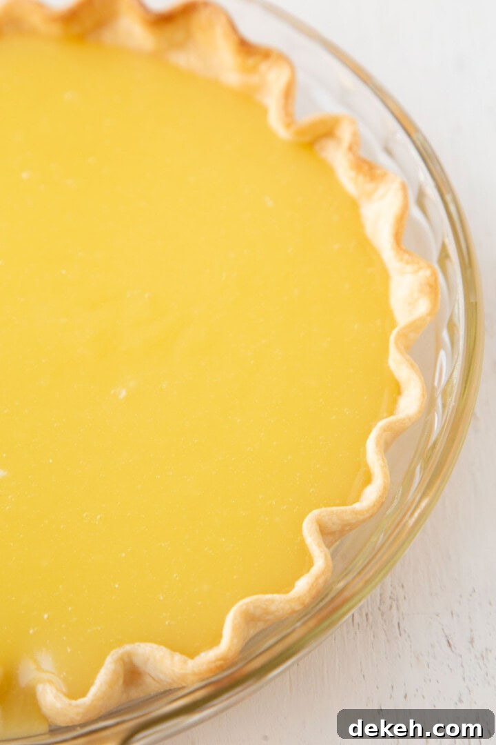 yellow lemon filling in a pie shell.