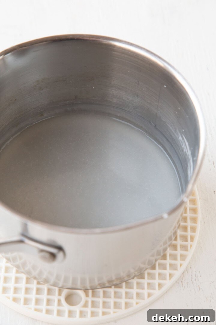 somewhat clear mixture in a saucepan made with cornstarch and water.