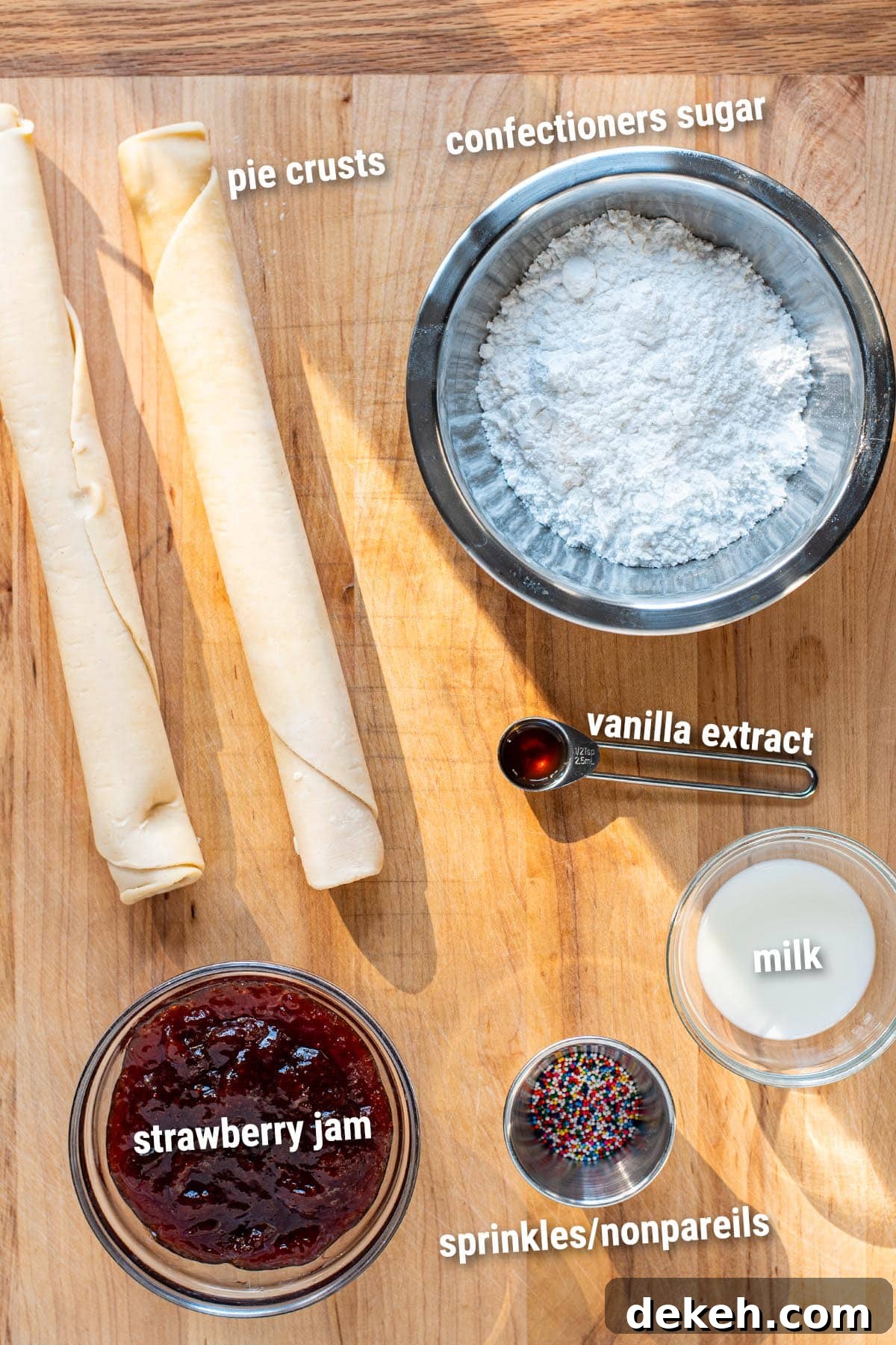 Raw, uncooked skillet Pop Tart ingredients laid out on a wooden cutting board.