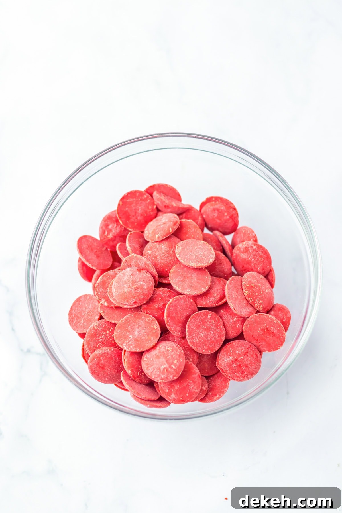 An overhead image of candy melts in a bowl.
