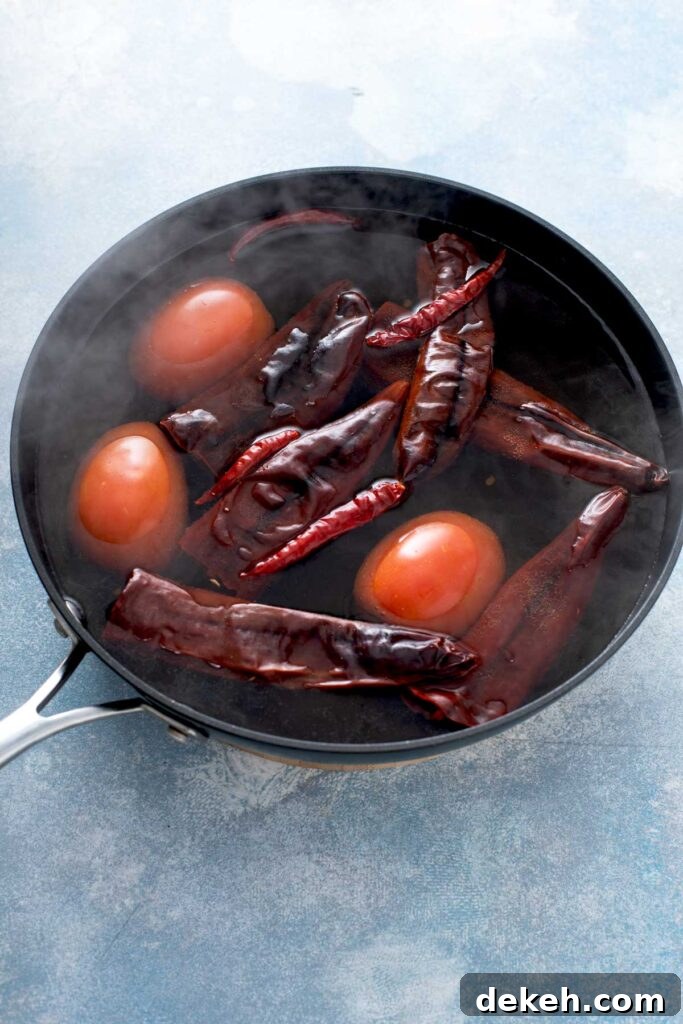 Diablo Shrimp (Camarones a la Diabla) — Spicy Mexican Shrimp Recipe 6 Dried chiles and whole tomatoes in a pot of boiling water