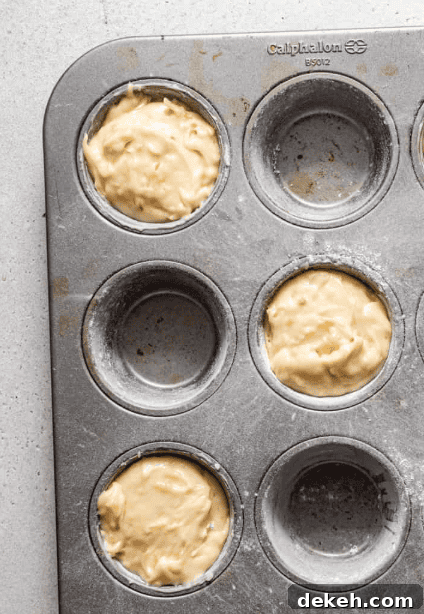 cake batter in a jumbo muffin tin.