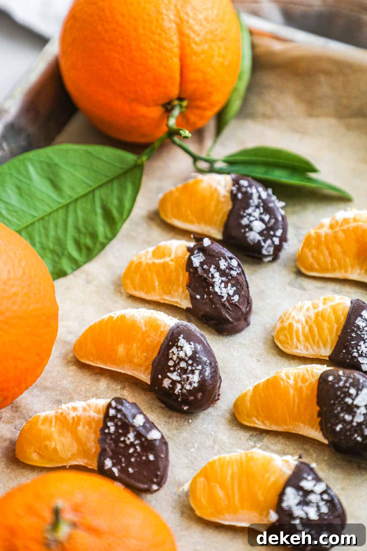 Chocolate-covered mandarin orange slices with semi-sweet chocolate and flaky sea salt.