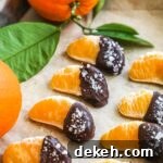 Chocolate-covered mandarin orange slices with semi-sweet chocolate and flaky sea salt.