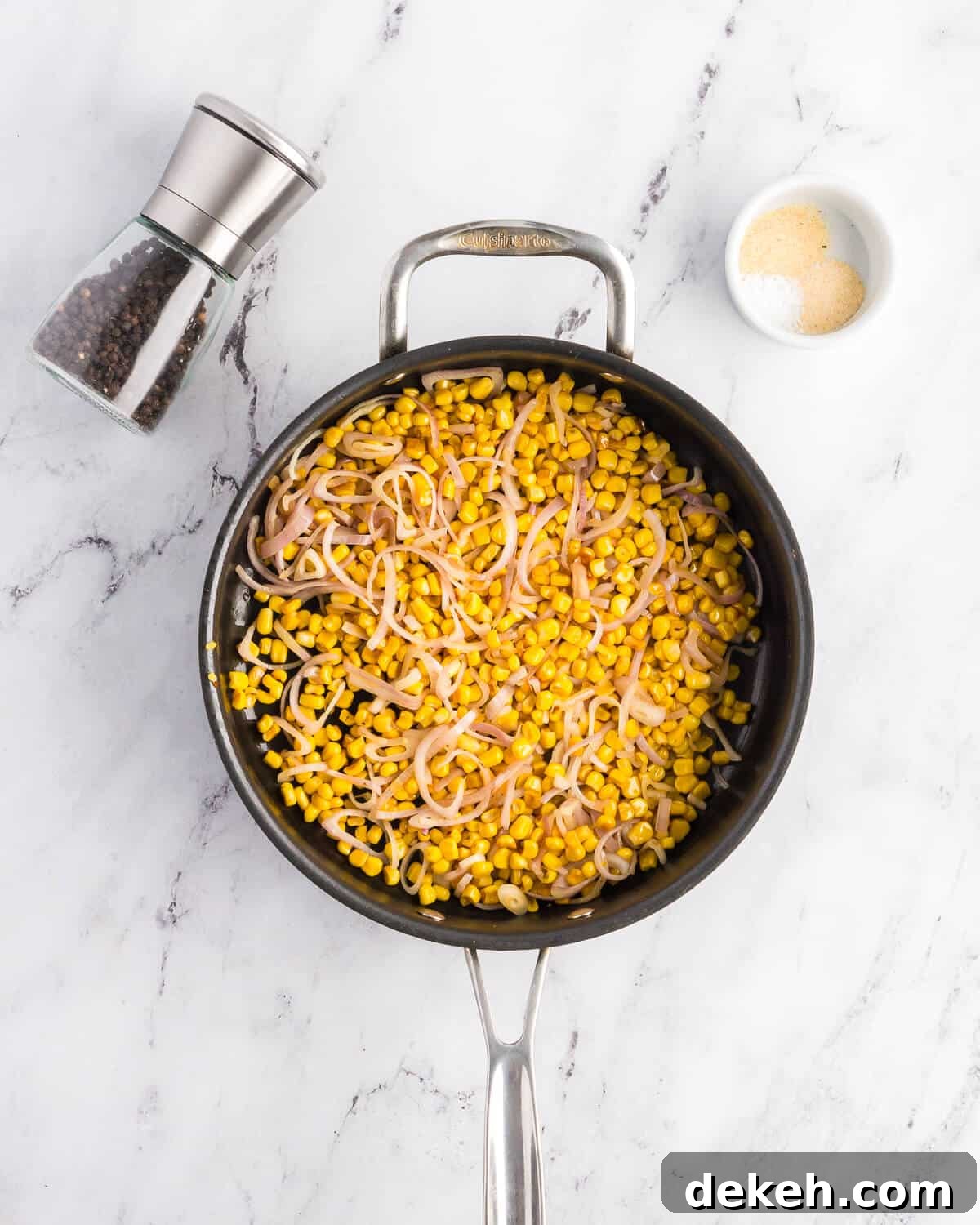 corn and shallots in a skillet. 