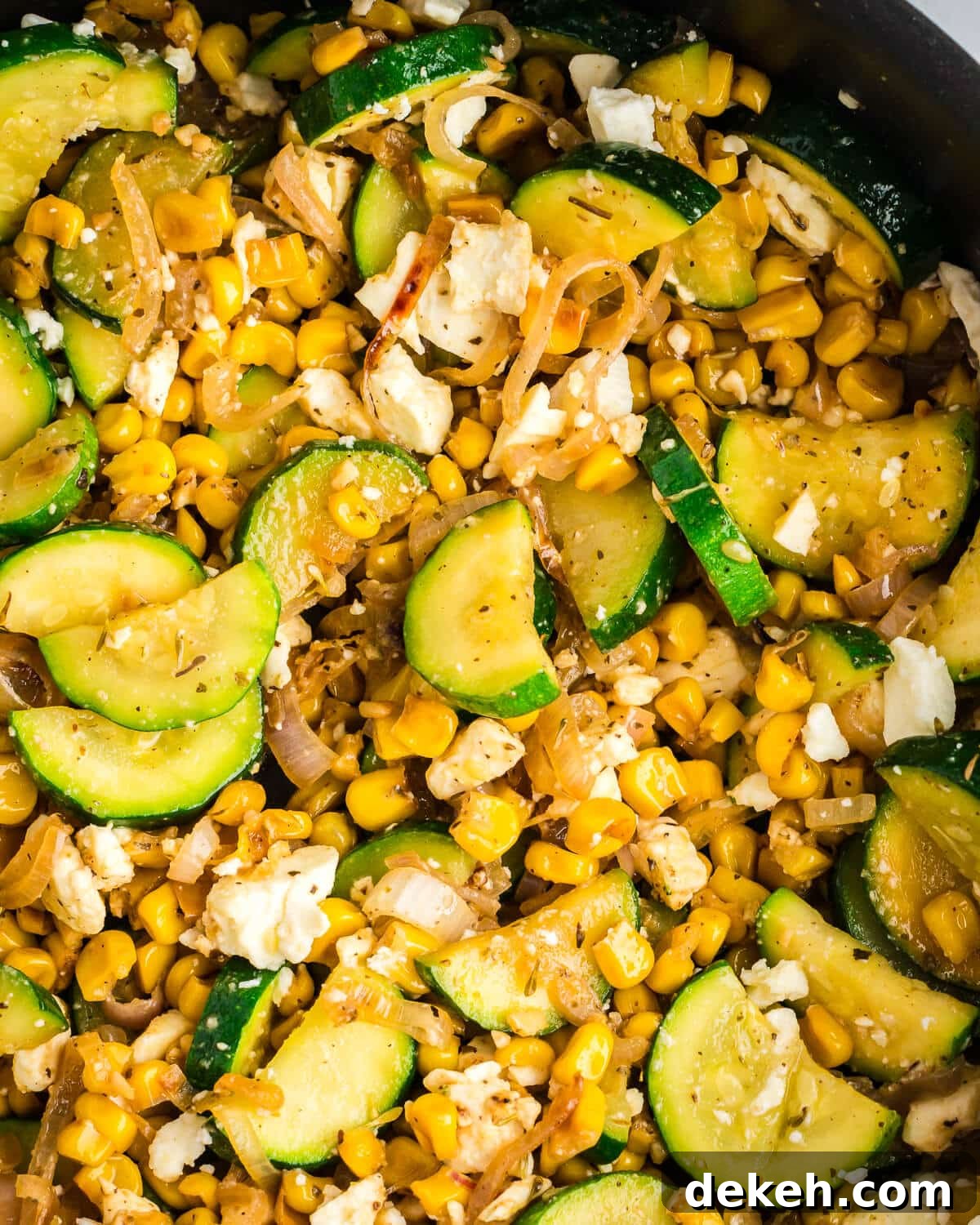 close up of sauteed zucchini and caramelized corn. 