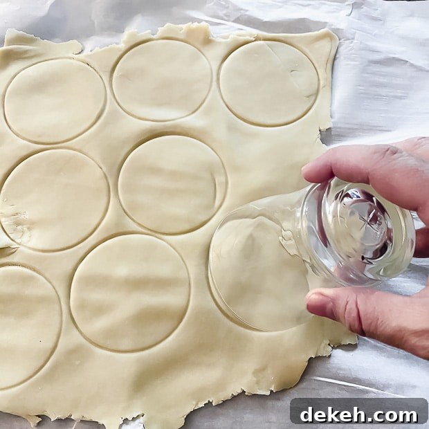 Using a glass make dough circles to make hamantaschen