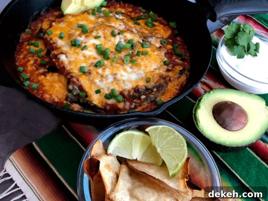 baked chile rellenos in a cast iron pan with chips, sour cream and avocado