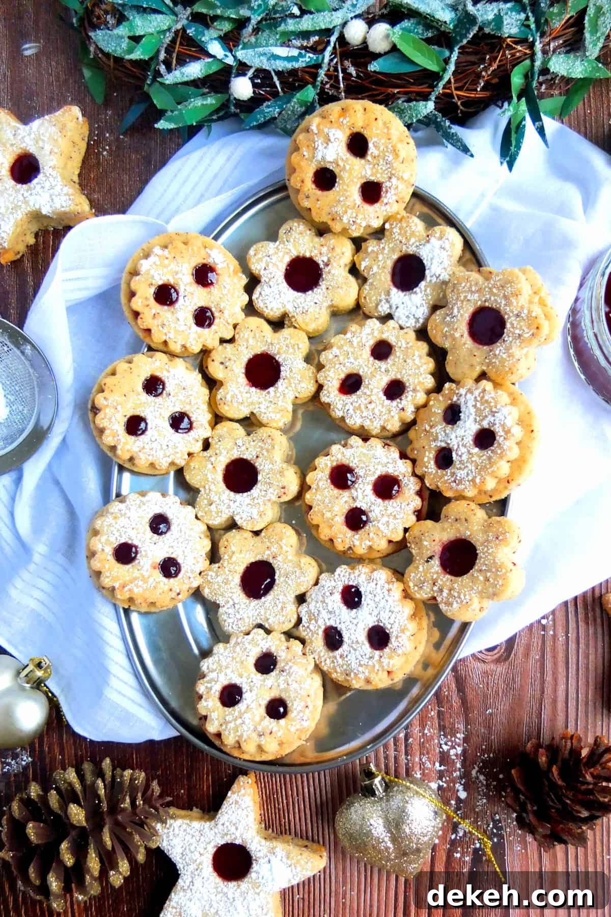 Variety of Spitzbuben cookies on a Christmas platter.