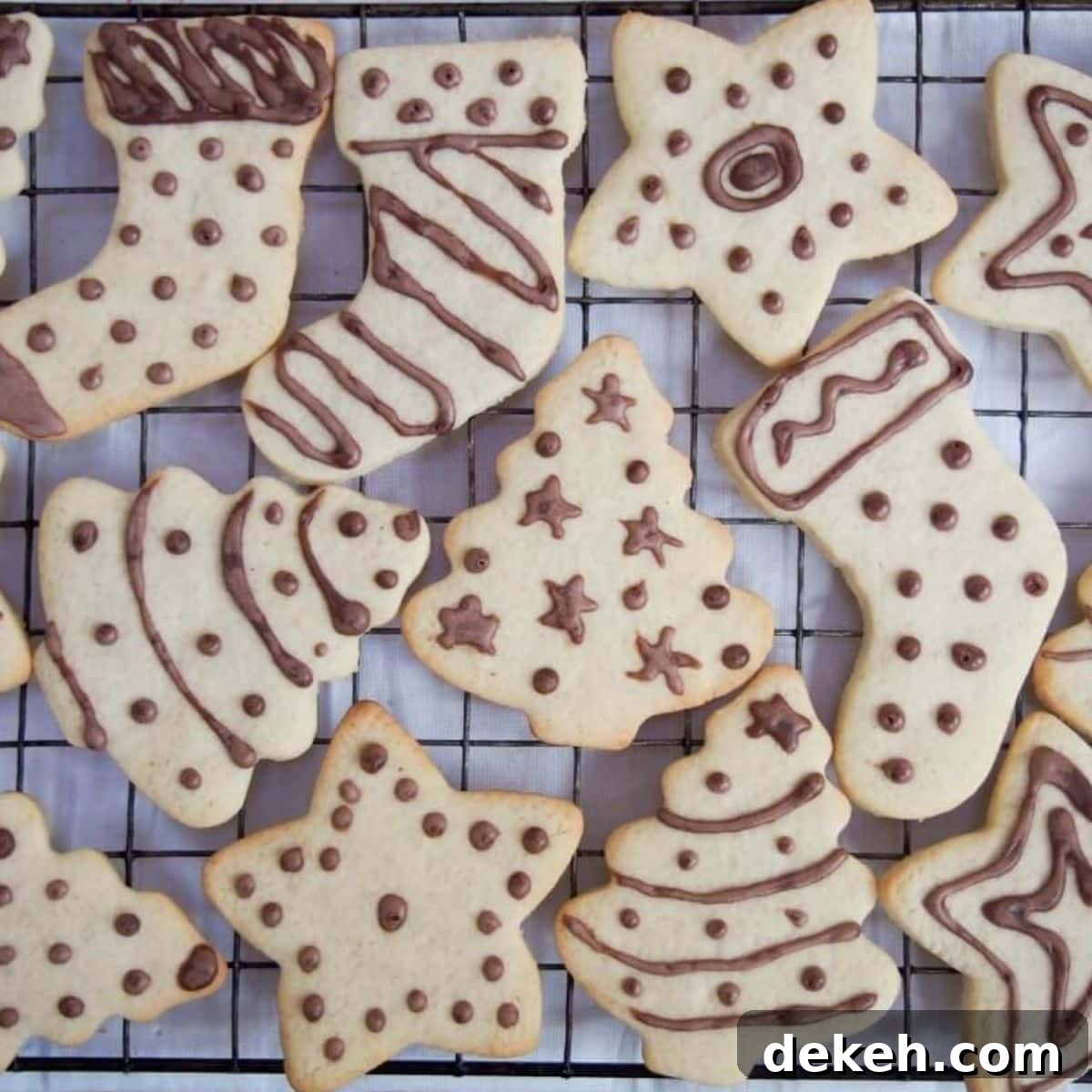 Variety of Ingwerplatchen (German Ginger Cookies) on a cooling rack.