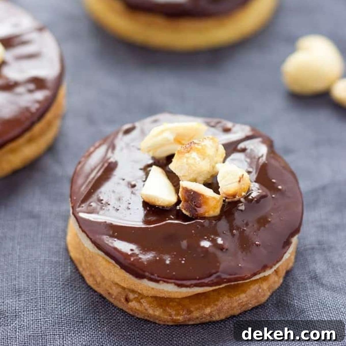 Closeup of a Hausfreunde German cookie with caramelised cashews on top.