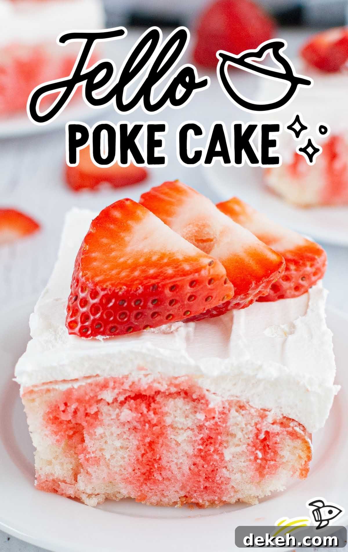 close up shot of a slice of jello poke cake topped with whipped cream and strawberry slices on a plate