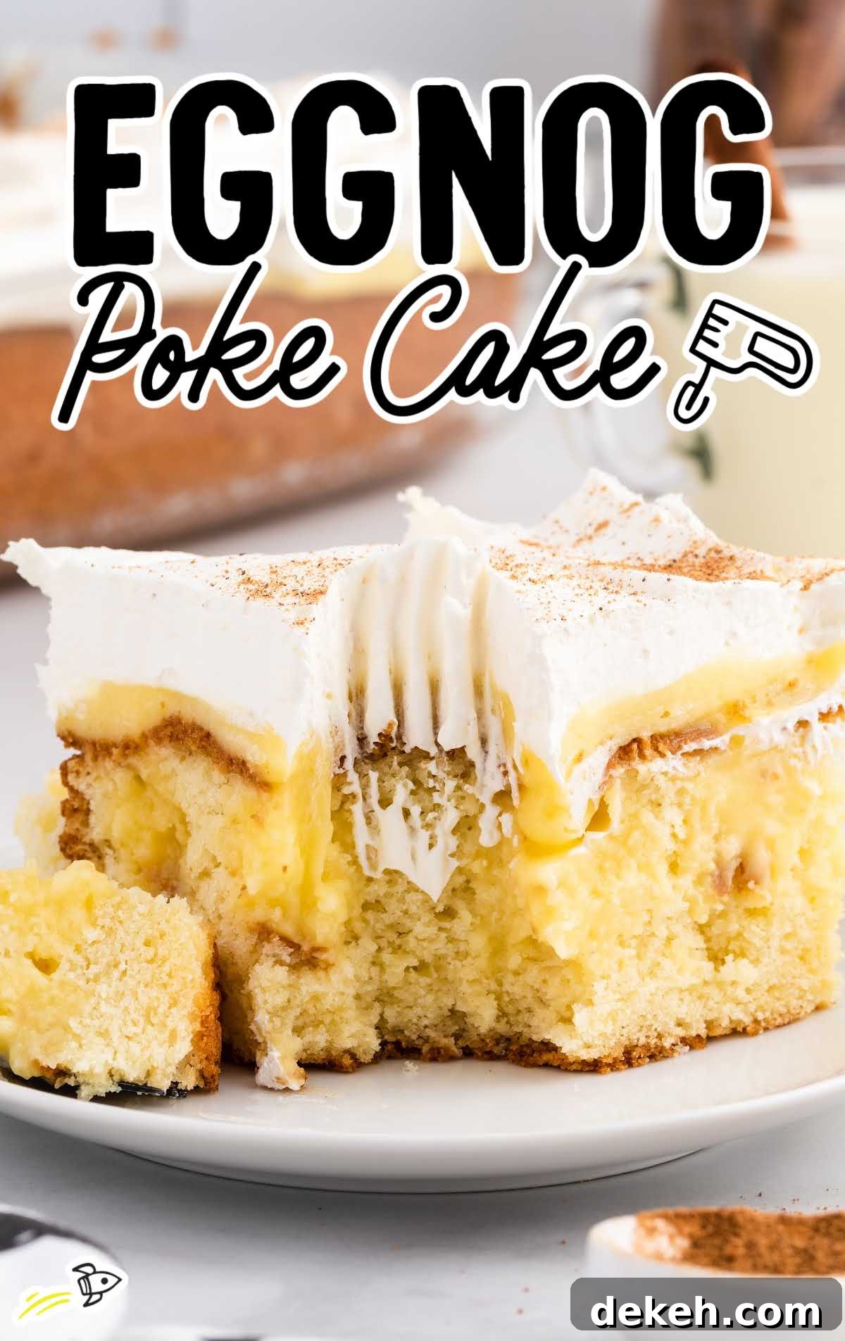a close up shot of a slice of Eggnog Poke Cake on a plate