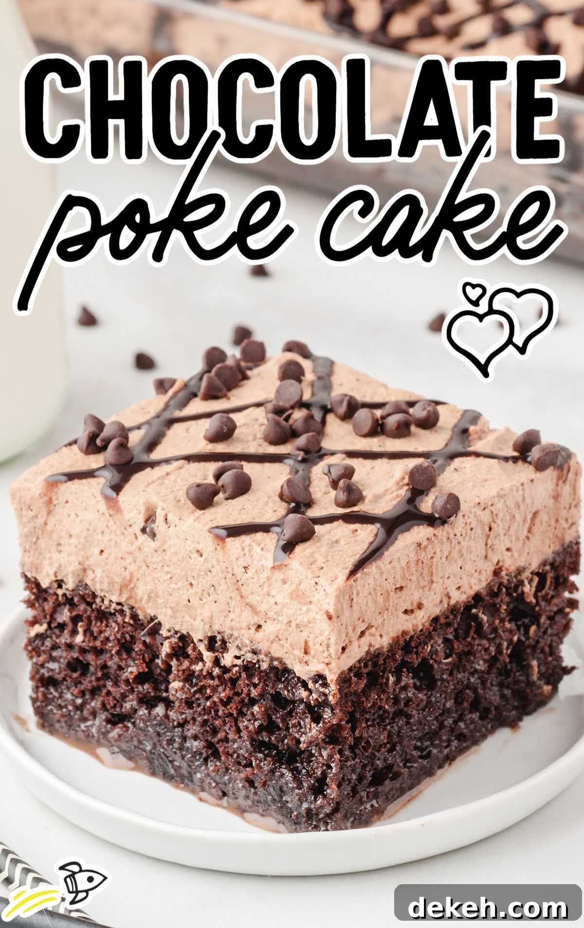 close up shot of a slice of chocolate poke cake garnished with chocolate chips on a white plate