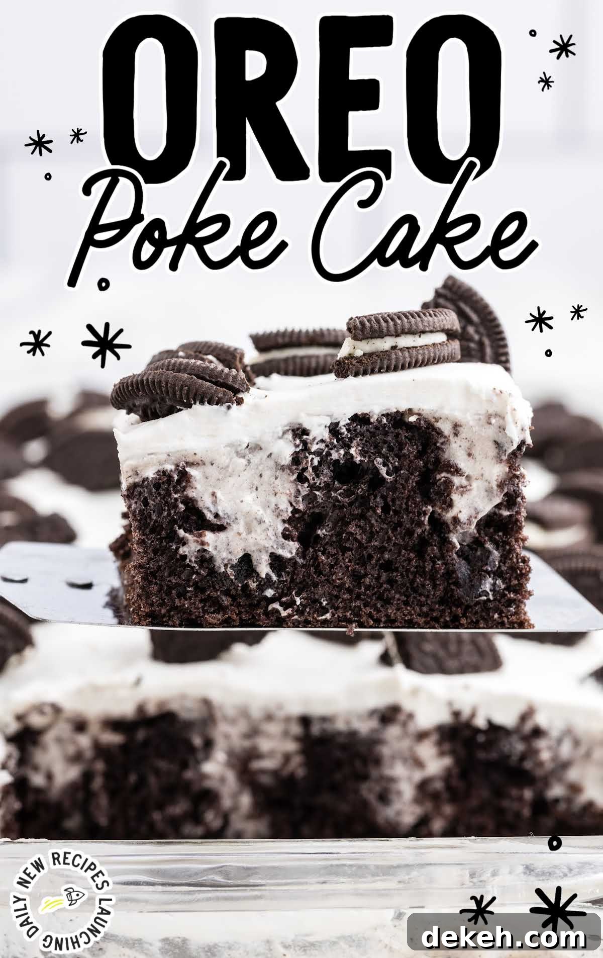 close up shot of a slice of Oreo Poke Cake garnished with pieces of Oreos on a spatula