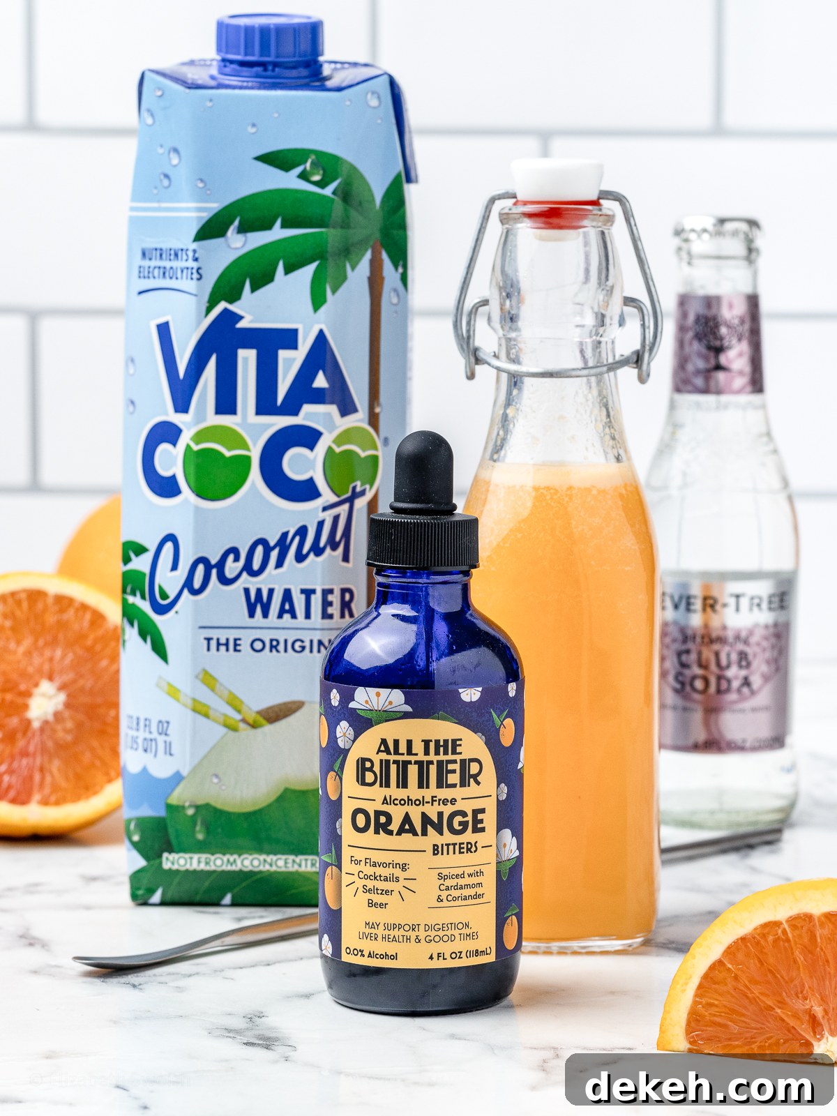Ingredients. Coconut water, freshly squeezed orange juice, alcohol free orange bitters, and club soda.