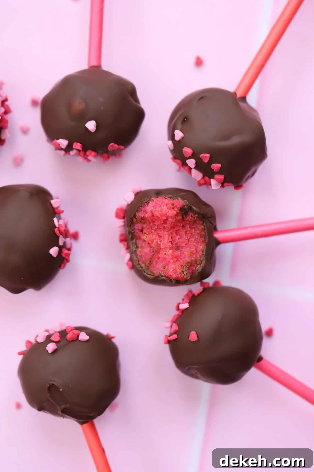 Inside a chocolate-covered cake pop with a pink centre.