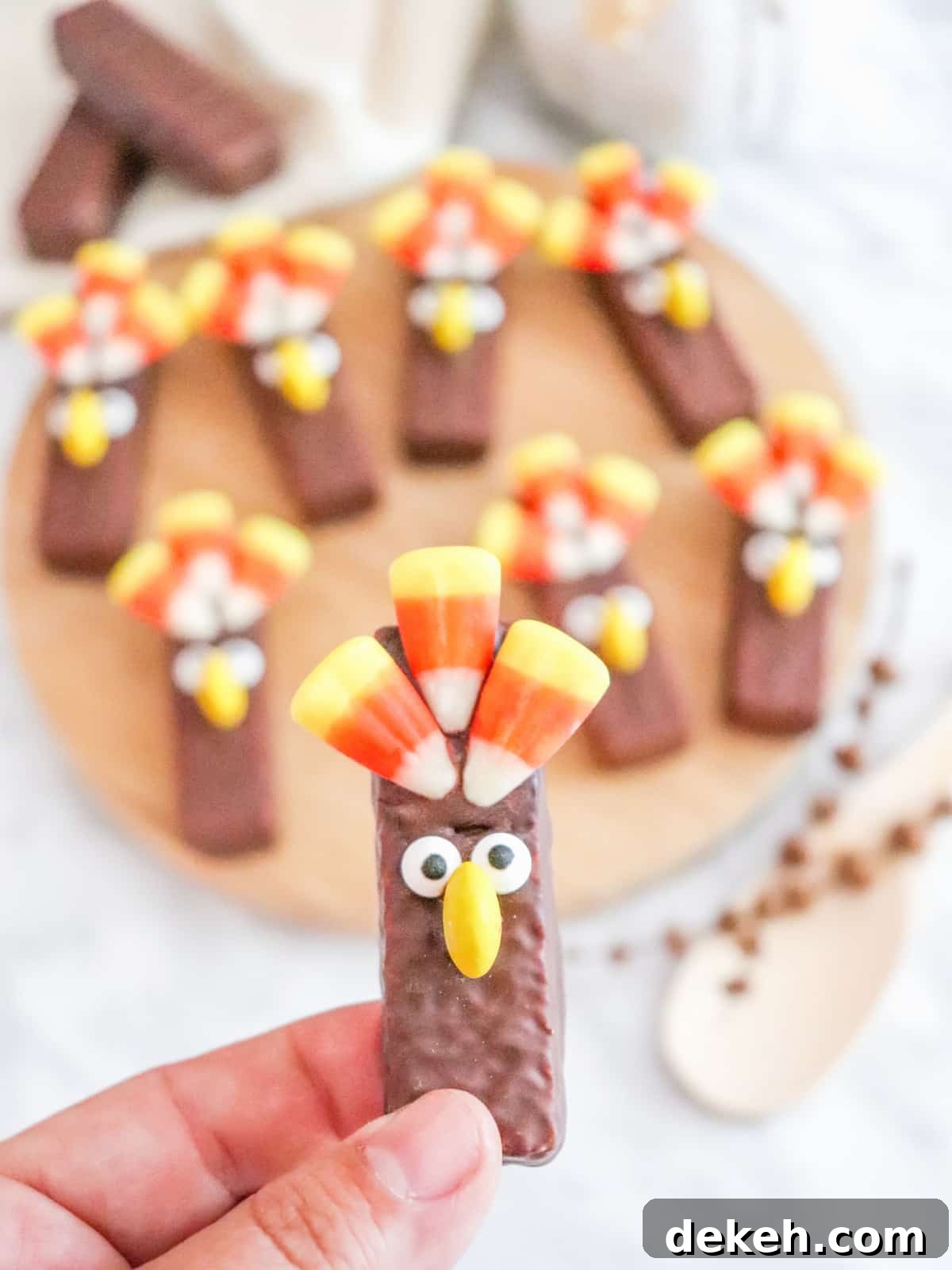 Hand holding a decorated Turkey Wafer Cookie