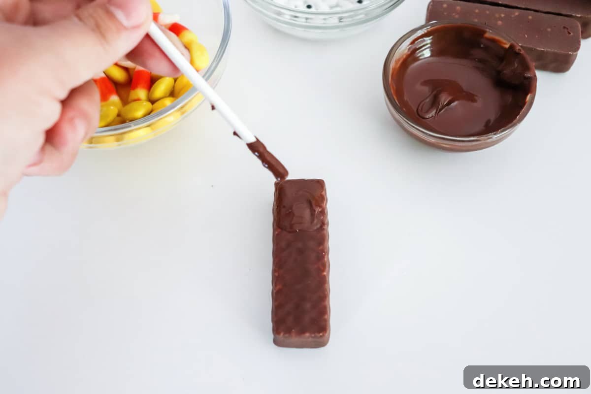 use melted chocolate to attach candy