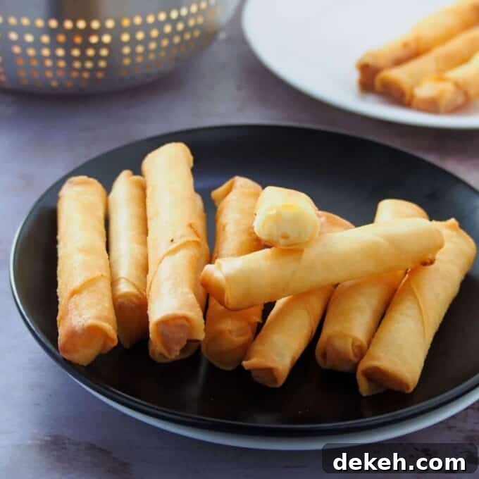 Cheese Sticks on a black plate