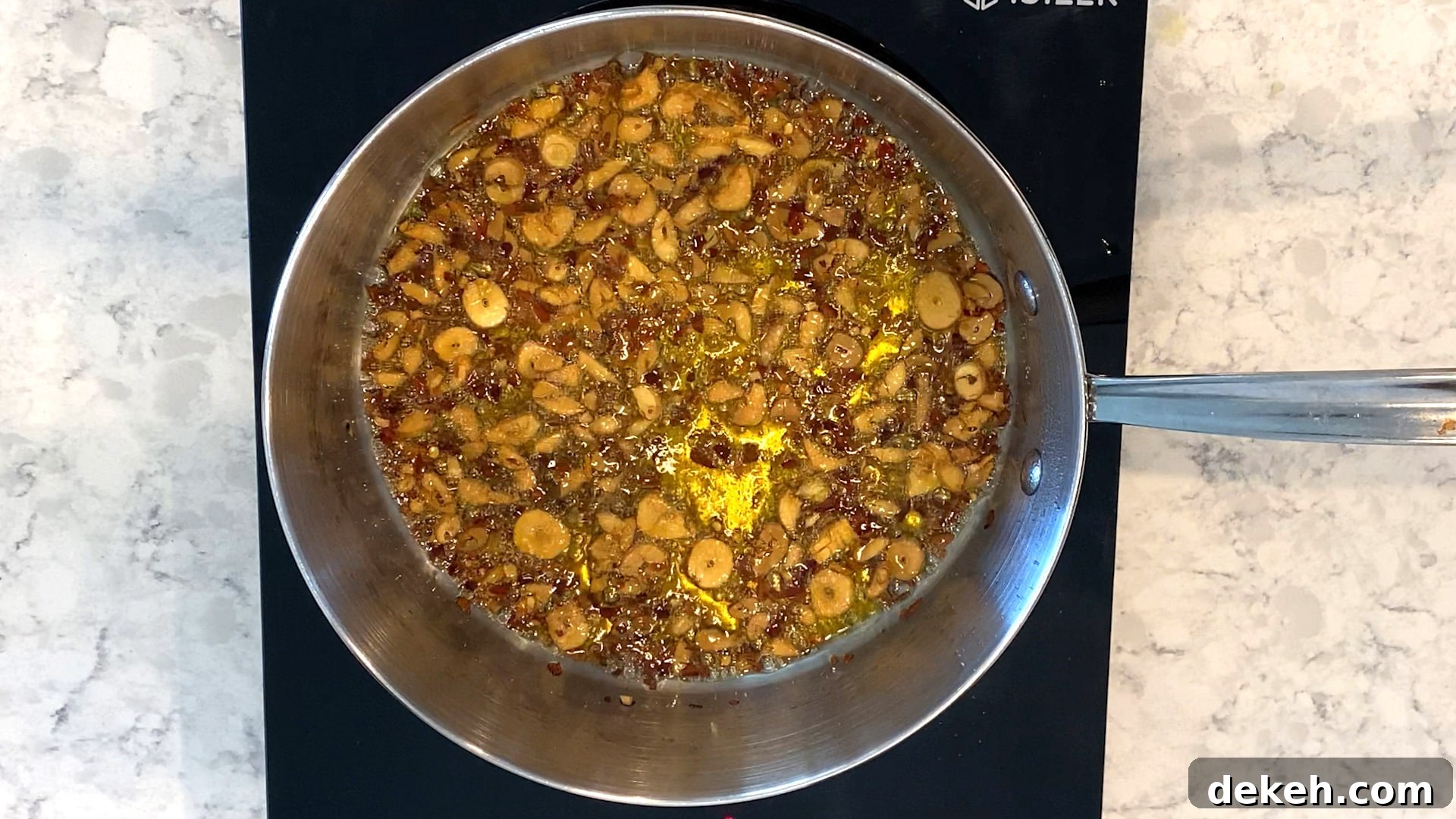the oil changes color when you add the red pepper