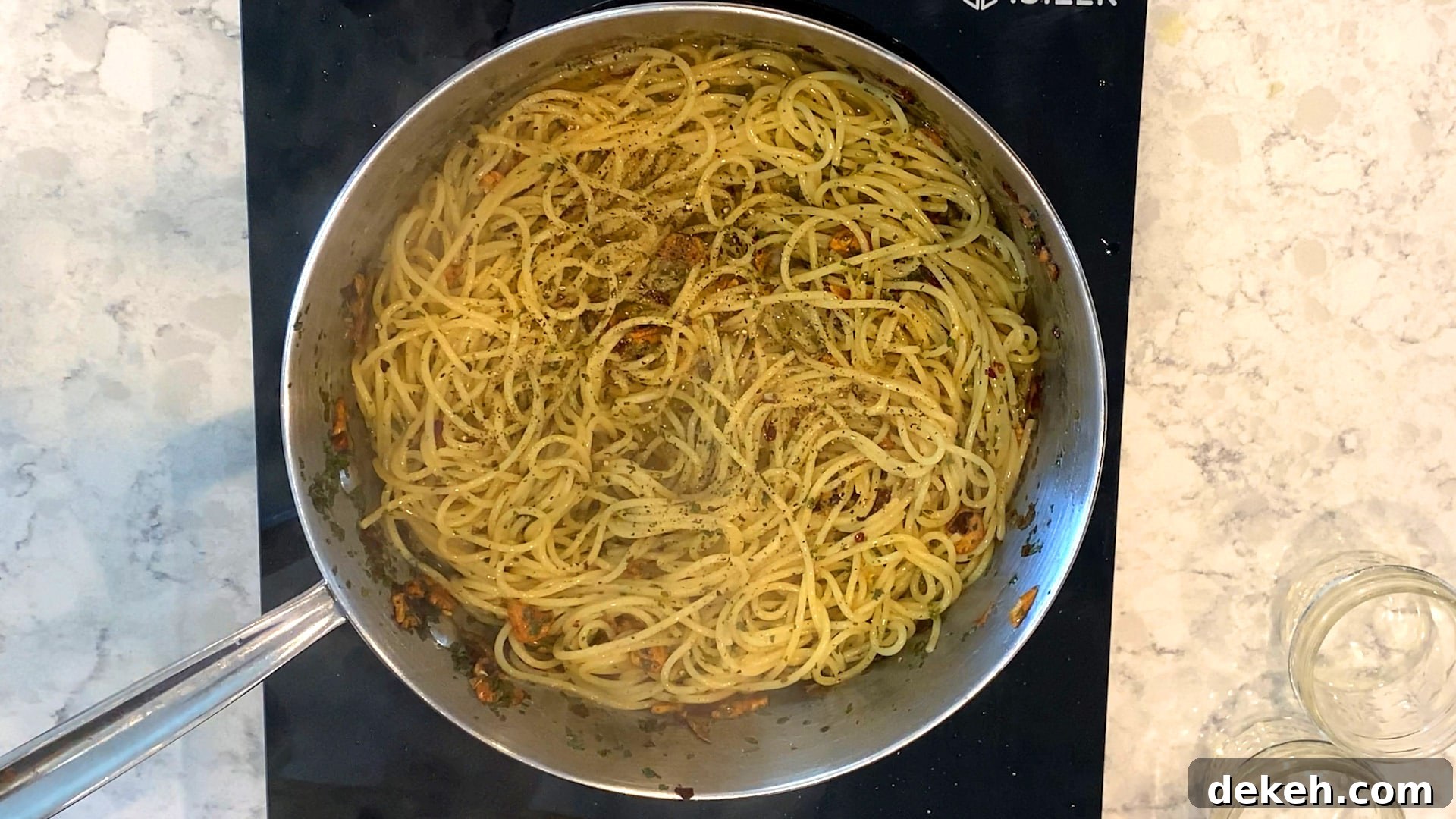 Garic & red pepper pasta in a pan