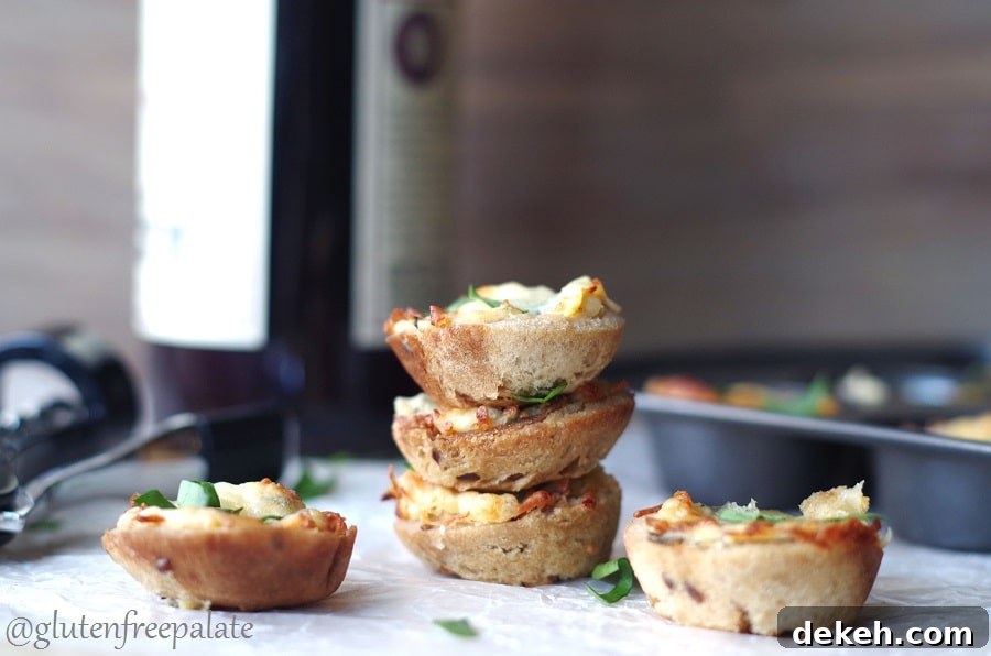 Gluten-free spinach bites stacked on parchment paper, three mini bites with melted mozzarella