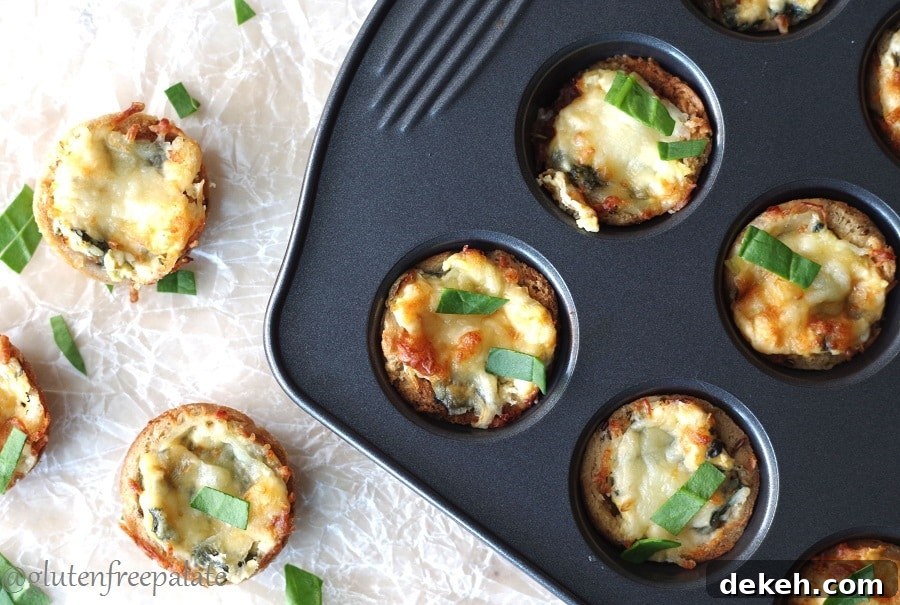 Gluten-free spinach bites in a mini muffin pan from above on parchment paper