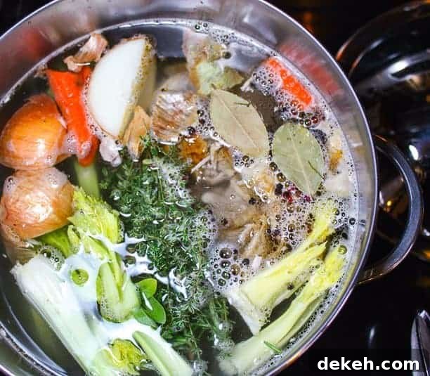 A close up of a pot of soup on a stove