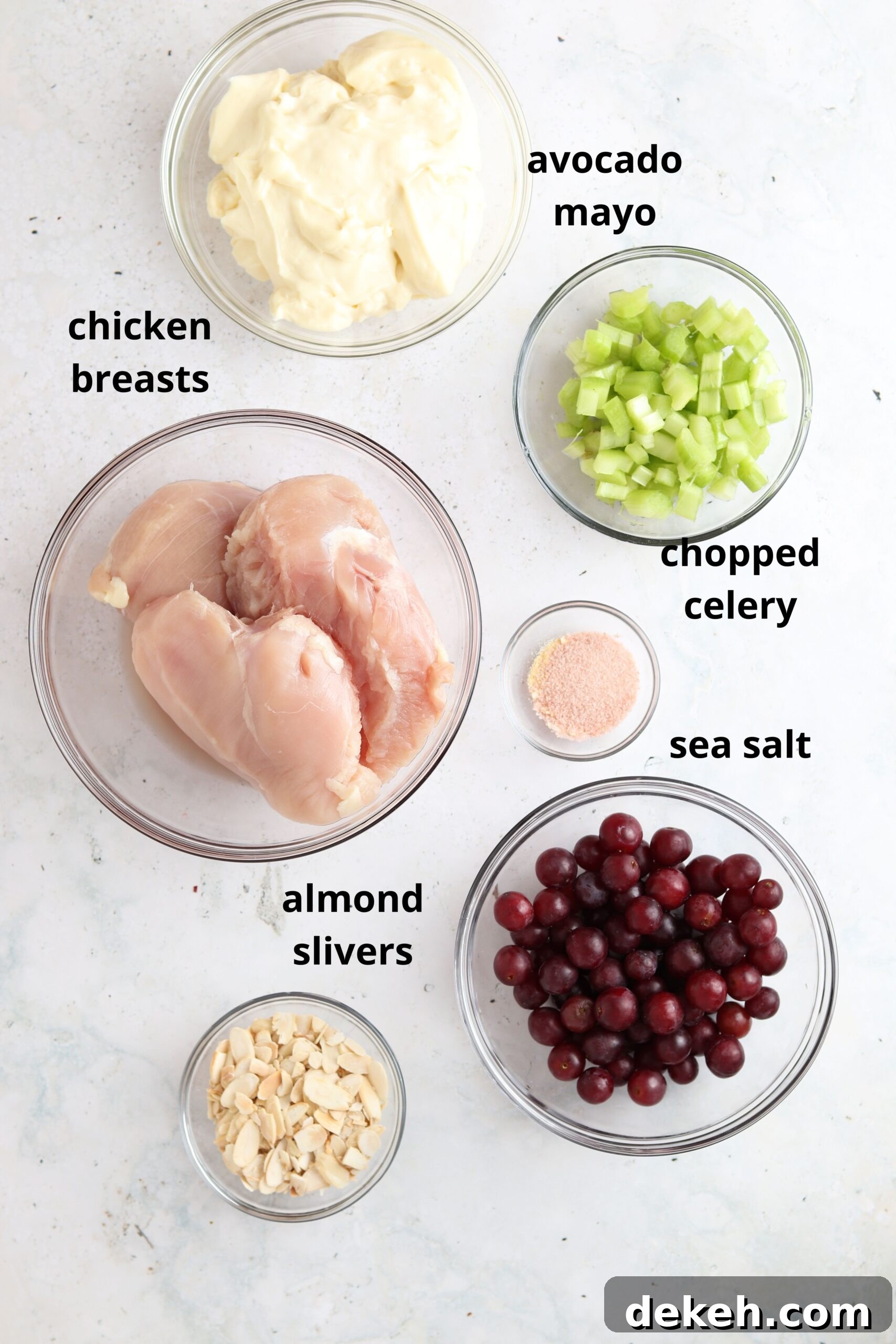 Whole30 chicken salad ingredients in small glass bowls. 