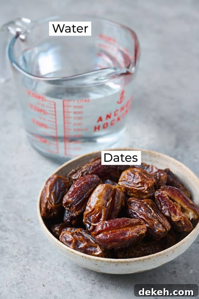 Ingredients needed to make date syrup displayed in glass measuring cup and bowl of medjool dates