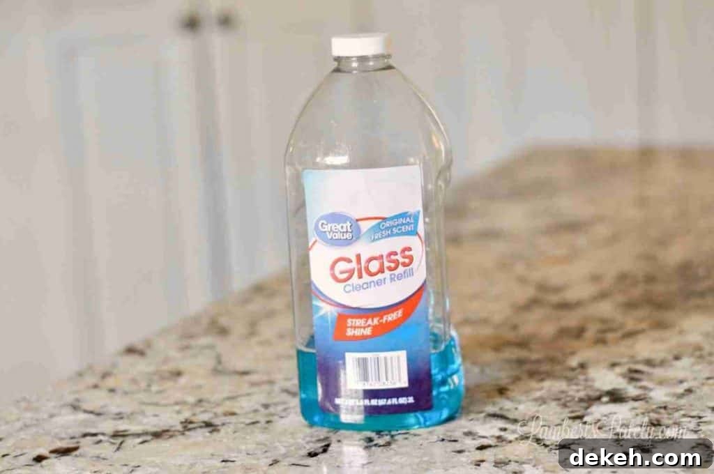 bottle of glass cleaner on a counter.