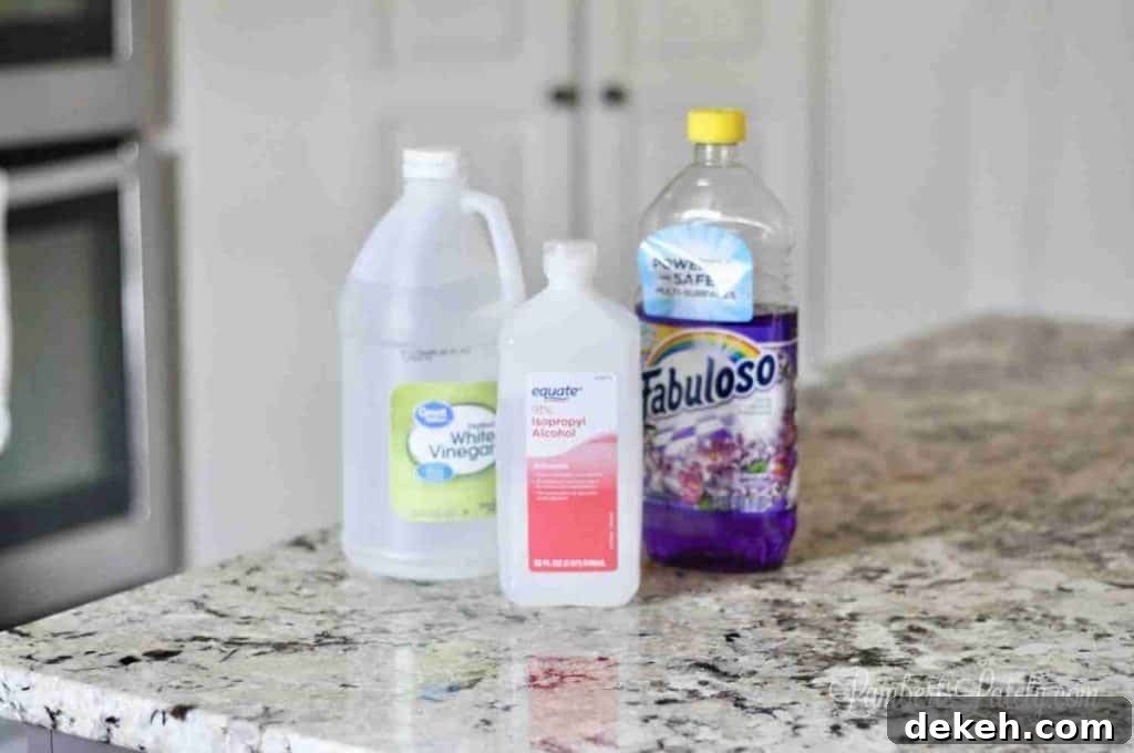 bottles of fabuloso, vinegar, and rubbing alcohol.