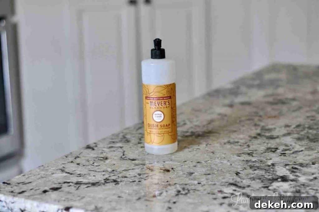 mrs. meyer's dish soap bottle on a kitchen counter.